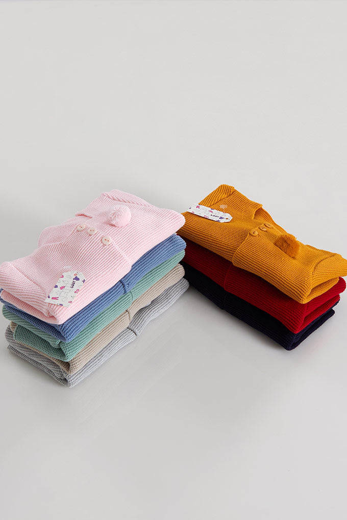 Casaco de malha com pompom